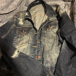 Ripped denim jacket.